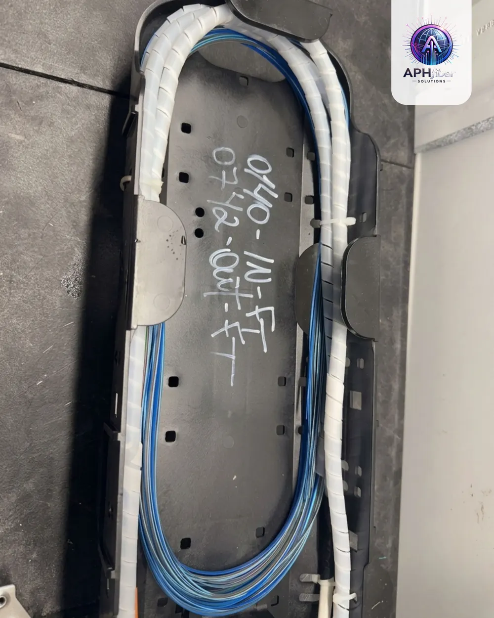 Labeled fiber bundle routed inside a splice enclosure